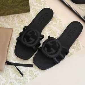 Gucci Black Slide Sandals with Camellia Embellishment